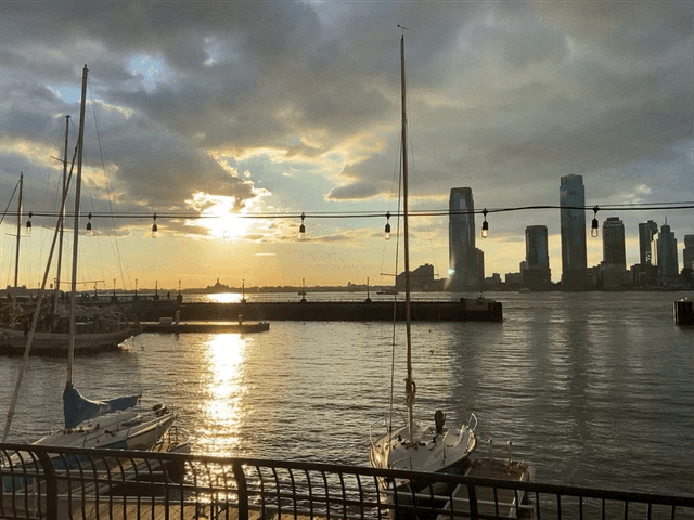 waterfront with dock and city on the skyline